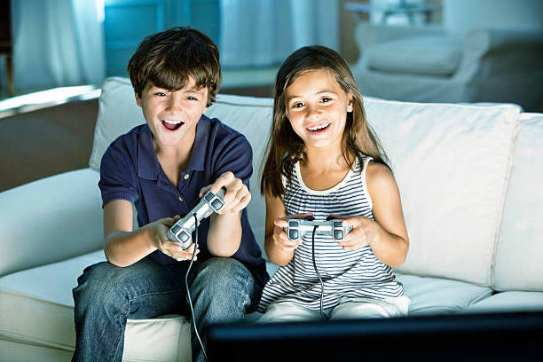 children playing video games at home